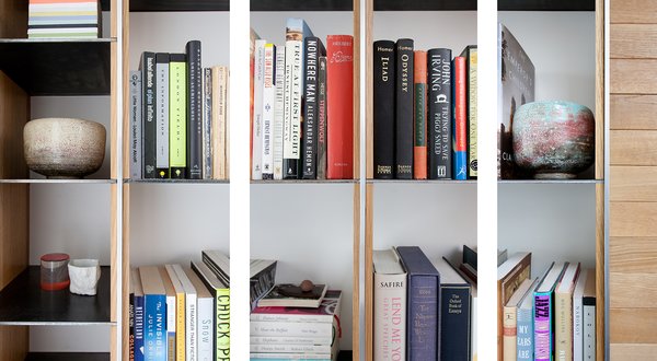 Boxes and boxes of Zack’s books found a new home in the custom library wall, fabricated with hot rolled steel, white oak, and aluminum. In the middle of the wall-to-wall bookshelves is a flat white oak panel where every board was custom-milled to perfectly fit the space. Franz and Paré-Mayer worked strategically to elevate simple materials. Design details such as the custom steel in the built-in bookshelves and aluminum handrail on the stairs were developed exclusively by Franz and Paré-Mayer for their clients, not to be repeated or reworked in any other projects. Photo 6 of KS Mission modern home
