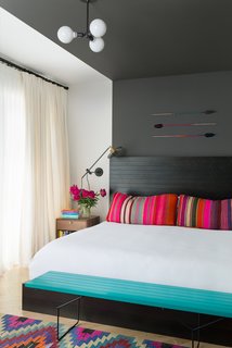 Color Me Mad! - Photo 19 of 31 - The bed in the master bedroom is a custom JHID design in ebony-stained fir. Lighting is kept subtle, in the form of an overhead fixture by Schoolhouse Electric and wall sconces by Workstead. The arrows are by Fredericks and Mae.