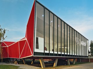 The structure contains a museum, shop, theater, and access to the factory where visitors can see the chocolate-production process.