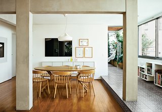 Architects Simone Carneiro and Alexandre Skaff used materials like cement-tiles and perobinha wood to make a fomerly cramped São Paulo apartment feel more open. Re-envisioning an under-utilized terrace as a lush garden certainly helped as well.