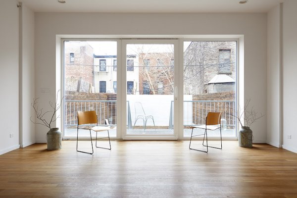 Architect Paul Castrucci found that when designing a passive house for an urban environment, he didn’t have to take many extreme measures as long as the apartment layout was smart and strategic. Like many efficient homes of this caliber, the 13-16 inch thick walls provide serious insulation and a tight envelope. Photo of R-951 modern home
