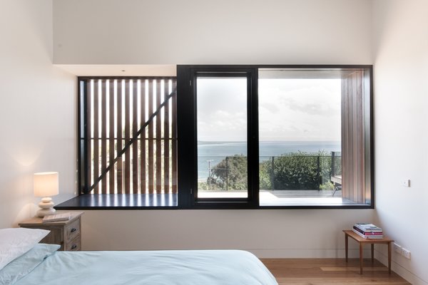 External shutters and screens allow the homeowners to manage the sunlight and cross ventilation in certain rooms. Manos Mavridis, also of OLA Studio, explains, “There was a preference for the screens to be manually operated to minimize ongoing maintenance costs and encourage user engagement with their environment." Photo 6 of Martha modern home