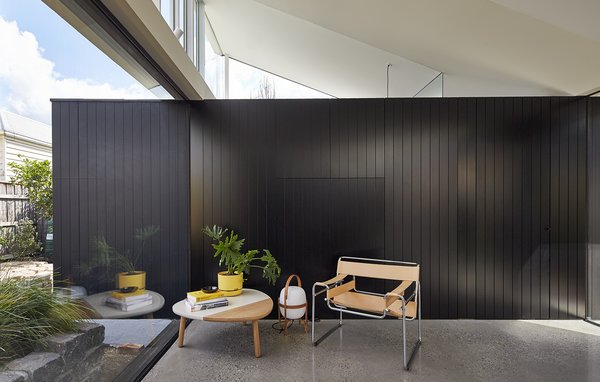 “We kept the tones very neutral because we wanted the colors of the garden to come through,” Ong says. “Light also plays an important role here, and again the neutral tones help highlight the changes in the light and sky.” Ong’s team used Melbourne's Ajar Furniture and Design store to supply the home's furnishings, and this Marcel Breuer Club Chair Model B3 sits off the dining room. Photo 3 of Breeze modern home