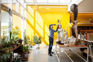 A Creative Dreamworld Complete With Neon Rooms and a Tropical Garden - Photo 8 of 11 - Here Tim tinkers with works-in-progress in his studio space, situated across the courtyard from Nathalie’s.