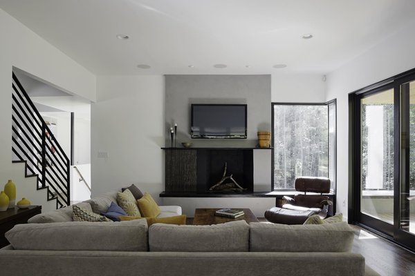 “We had to take into consideration that this young family was going to be living on a viable farm,” says interior designer Kris Ozburn of Second Mile Design. “So, selecting furniture that was practical but had good design was a priority.” Ozburn chose pieces like the sectional sofa from Precedent that felt timeless and modern. Photo 5 of The Farmhouse modern home