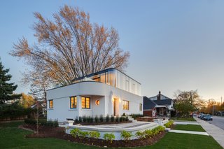The home's white stucco exterior is actually a thin layer of stucco spread over a modern EIFS (Exterior Insulation and Finishing System) from Dryvit.