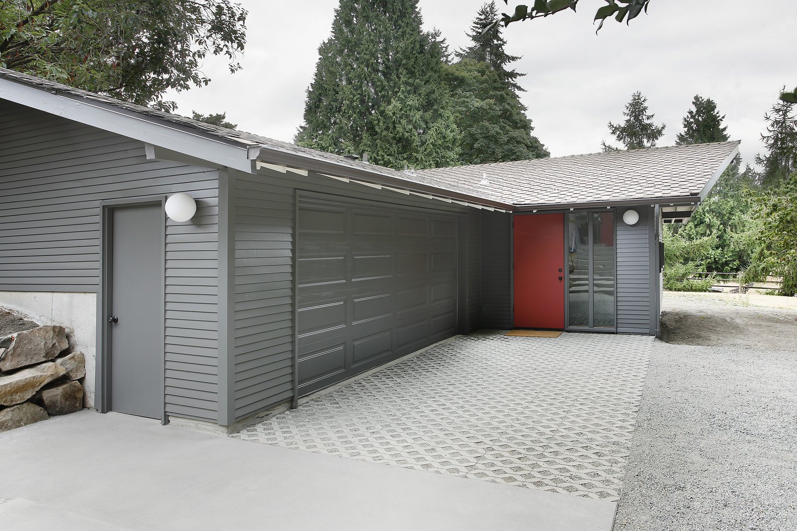 “The stable/garage was built with two intersecting gable roof forms,