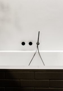 We Can't Get Enough of This German Apartment's Sleek Matte-Black Kitchen - Photo 8 of 11 - Fixtures by Naoto Fukasawa for Aboutwater, a collaboration between Boffi and Fantini, adorn the Villeroy & Boch tub.