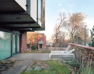 On all three aboveground levels of the house, outdoor spaces feature as prominently as indoor ones. The backyard is lined with tiered concrete boxes for planting vegetables; the modest top floor—which houses the master bedroom—has a deck wrapping three sides; and in the middle, a 770-square-foot green roof extends off the living area.<br><br>Don't miss a word of Dwell! Download our FREE app from iTunes, friend us on Facebook, or follow us on Twitter!
