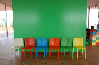 Color Me Mad! - Photo 16 of 31 - The bright-green hue of this wall, seen just inside the entrance, was used as a complementary color throughout the property.