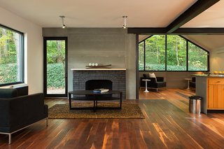 Steel Preserve - Photo 5 of 5 - Industrial finishes include Viroc cement fiber panels over the fireplace. 