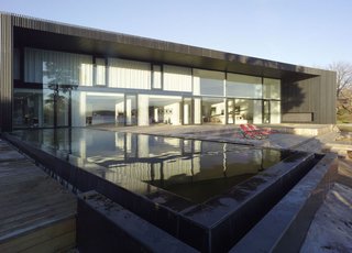 Go Inside the Whimsical and Geometric Mind of Gert Wingårdh - Photo 2 of 9 - Villa G The exterior of Villa G is made from vertical wood slates that reference trees from the surrounding landscape.