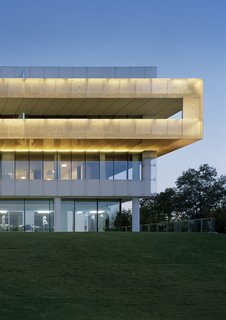 Go Inside the Whimsical and Geometric Mind of Gert Wingårdh - Photo 6 of 9 - The House of Sweden The House of Sweden is not your typical embassy in Washington, D.C. Instead of a closed-off building, Windgårdh built a translucent structure that is open and inviting. In the entry level, sliding doors open during warmer seasons and even features a lily pond. Inspired by a wicker lamp, the wooden balcony that wraps aroun the entire thrird level light up in the evening to emulate Nordic light. 