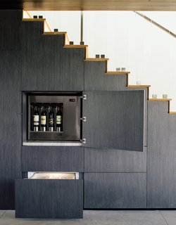 Wouldn't You Like to Have Your Own Private Concerts at Home? - Photo 6 of 10 - The wall beneath the stairs holds hidden storage, including an Enomatic wine dispenser and Sub-Zero refrigerated drawers.