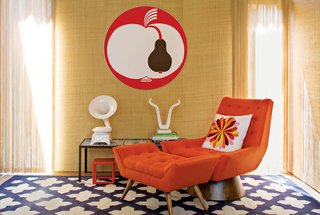 Jonathan Adler and Simon Doonan Go Trippy Contemporary on Shelter Island - Photo 9 of 12 - "I want everything to have a sense of place," says Adler. "To me Shelter Island is a rustic, relaxed place." Oatmeal grass cloth wallpaper, a Talitha rug, and Whitaker chair and ottoman, all by Adler, and vintage artwork instill the interior with a comfortable retro quality.