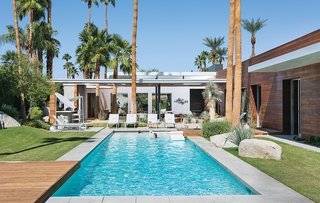 One Canadian Family Beats the Cold by Escaping to Palm Springs - Photo 1 of 12 - Architect Sean Lockyer designed a 5,760-square-foot concrete, stucco, and ipe home for a couple and their three children in the Southern California desert town of Indian Wells. The residents selected the home's furnishings, including the Royal Botania chaise lounges. 