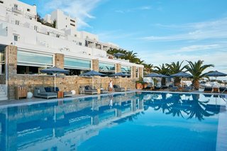 Everywhere you turn on the resort's property, your eye is drawn to the water. The classic Greek structure stands aside a sleek pool that looks out to the Aegean Sea. 