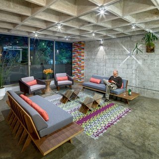 This Retro Apartment Is Finally the Good Kind of Funky - Photo 1 of 7 - Arqmov Workshop began their renovation by stripping the apartment down to the basics. Removing finishes revealed a polished concrete floor and waffle-slab ceiling.