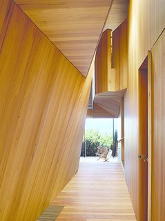 This Surfer Rules the Ocean from a Cliffside House - Photo 2 of 9 - The house that architect John Wardle designed for a couple in coastal Fairhaven, Australia, twists and bends to comply with local laws that prevent buildings from disrupting the ridgeline views from the Great Ocean Road.