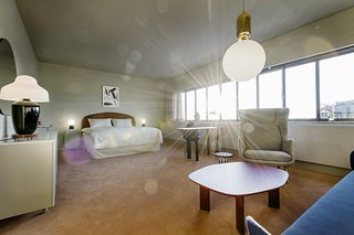 The panoramic window defines the space. "It's the most important architectural element in the room," Hayon says.