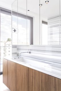 The vanity, installed an EB sink from Alape, is also custom. PSLAB is responsible for the apartment's lighting concept. 