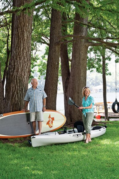 The Lakeside Getaway That Entertains All Ages - Photo 2 of 6 - Owners Dudley and Sandy Youman keep a flotilla of watercraft ready for entertaining their children and grandchildren. Interior designer Herb Schoening worked with the Youmans on the furnishings and finishes for the their 480-square-foot-cabin.