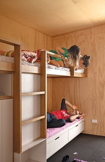 Students Pass Their Class by Building a House in New Zealand - Photo 7 of 7 - Architect Dave Strachan and the Unitec students designed and built the living room sofa and bunk beds. The carpet squares are by Interface.