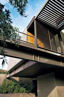 Twenty-two 12-foot-wide steel-frame modules were combined to form nine to 14-foot-high rooms that were stacked and bolted together. Ten deck modules added more than 4,700 square feet of sheltered outdoor space. Image courtesy of Jill Paider.