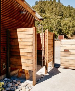 Though the home includes a full bathroom, the Bairds primarily use the outdoor shower for bathing; the fixture is from Signature Hardware. 
