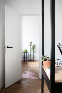 The Moscow Minimalists - Photo 2 of 6 - For a beauty parlor in Moscow, the studio kept the structure’s original 19th-century flooring intact, filling in areas with pink patches. 