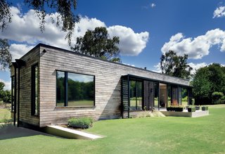The Home That Arrived by Crane - Photo 1 of 3 - When planning regulations limited what could be built in an English forest, PAD Studio devised a prefab structure that can be moved by crane. "The whole building is based around a steel frame, which provides us with the stability to be able to top-lift it easily," explains designer Ricky Evans. 