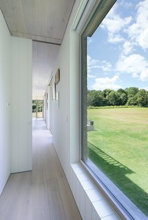 The Home That Arrived by Crane - Photo 2 of 3 - With expansive EcoHaus Internorm windows, the space feels larger than its 1,400 square feet. 