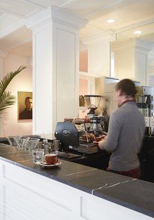 This Boutique Hotel Loves its City Like No Other - Photo 5 of 14 - Grab a cup of coffee from Bolt, located next to the seating area. 