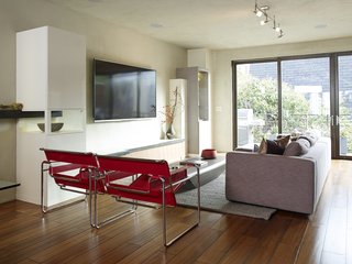 No Walls Were Knocked Down in the Making of This SF Pad - Photo 1 of 7 - The living room is furnished with Wassily chairs by Marcel Breuer, a Limbo coffee table from Roche Bobois, and a Reid sofa from Design Within Reach.
