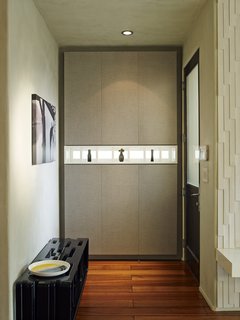 No Walls Were Knocked Down in the Making of This SF Pad - Photo 7 of 7 - Just inside the front door, another piece of custom casework is made from the Corsican Weave laminate from California Closets.
