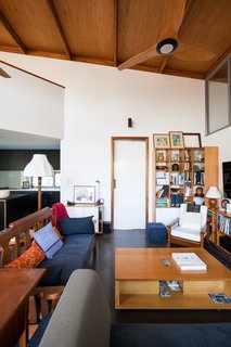 Thin, Mint: A Eco-Friendly House Rises in Compact Quarters - Photo 4 of 5 - The house was designed with an open floor plan to facilitate aging in place. </p><p><font color="#cccccc"><span style="font-size: 13px; line-height: 26px;">Courtesy of Mountford Architects</span></font></p><p><font color="#cccccc"><span style="font-size: 13px; line-height: 26px;"><br></span></font> <span style="font-family: 'Milo Serif Pro', serif; font-size: 22px; line-height: 1.8;">The living room is capped by a sloping plane of oiled LVL (laminated veneer lumber) and plywood. The angle of this high ceiling is oriented to the north, with a combination of cross ventilation, thermal massing, and sun shading devices used to passively achieve a comfortable temperature. Charcoal-burnished concrete floors also help absorb excess heat. </span>