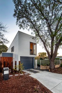 Thin, Mint: A Eco-Friendly House Rises in Compact Quarters - Photo 2 of 5 - The narrow structure is oriented to make the most of views of the tree-lined property, which helps passively regulate temperatures by blocking sun in summer and allowing in heat in winter.