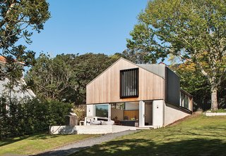 This Former Garage Is Clutter Free - Photo 1 of 4 - The Stradwick House by Space Division is clad in brick on the base, and a cedar rainscreen covers the top level. 