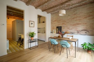10 Modern Renovations to Homes in Spain - Photo 5 of 10 - A confused layout meant that the original apartment had a series of dark, confined rooms. The designers eliminated a third bedroom and enlarged the living room. The previous kitchen was separated from the living area by a tight hallway. Nook's reconfiguration attached the kitchen directly to the living room, at the client's request.