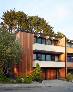 Over time, shingles had been added on the front facade. Referencing Claude Oakland's original drawings, the firm removed and replaced them with vertical grain Kayu-Batu siding. The balconies, also covered with wood shingles, received a plaster finish.