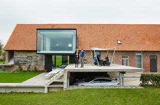 Atop the carport is a Hopper table and shade by Extremis. 