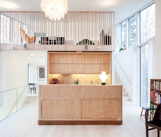 This Home Will Make You Want to Build Your Own Sauna - Photo 1 of 10 - Carpenter Matti Salminen, a family friend, built the birch cabinets and island for the kitchen of a new home outside of Helsinki. The architect, Tuomas Siitonen, situated a lofted family room on the mezzanine above.