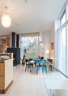 This Home Will Make You Want to Build Your Own Sauna - Photo 3 of 10 - The Carlos Scarpa chandelier and dining chairs by Werner West are both family heirlooms; the table is another custom design by Salminen.