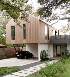 Narrow windows facing the street help create privacy on the upper level. 