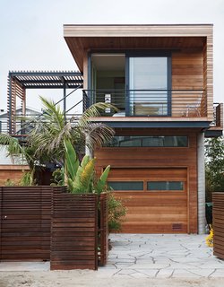 Rising Tides Are No Match for This Coastal Home - Photo 1 of 10 - On a sandy cul-de-sac in Stinson Beach, California, architects Matthew Peek and Renata Ancona built an elevated modern structure beside a modest 1940s bungalow. 
