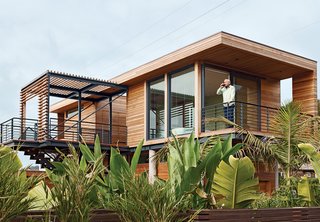 Rising Tides Are No Match for This Coastal Home - Photo 2 of 10 - From his perch Dwares can enjoy a glass of wine while gazing at the ocean. 