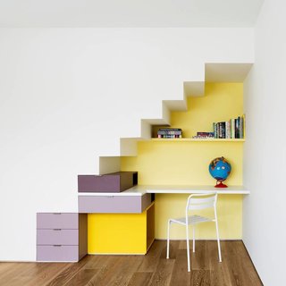 25 Bold Ways to Decorate with Yellow - Photo 3 of 25 - A modern home office with a pale yellow wall.