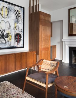 725 Square Feet and Loads of Modern Gems - Photo 3 of 6 - A significant art piece by Dana Louise Kirkpatrick and Bernie Taupin anchors the living room.