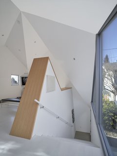 This Entertaining Guesthouse and Studio Will Inspire You to Start Making Art - Photo 3 of 5 - The second level is an oak floor. Even the painted white floor is considered a possible surface for projecting video art. 