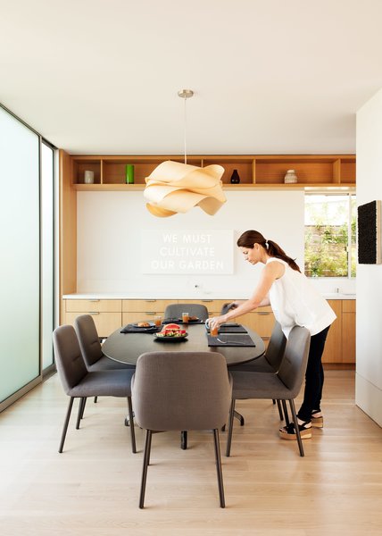 Amid a Hotbed of Architecture, This Home Holds Its Own - Photo 8 of 9 - A EuroStone countertop structures the open-plan kitchen and dining room, where the family will often gather and play. 